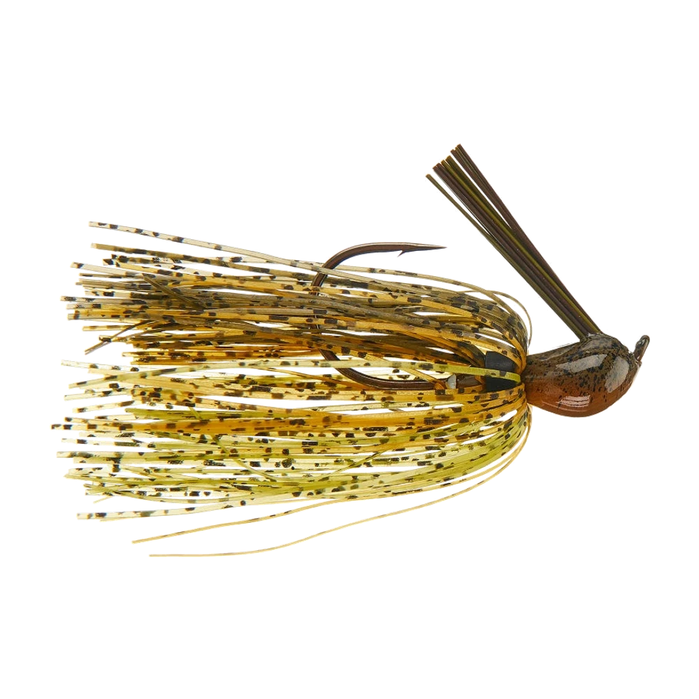 Kompakter Dirty Jigs Luke Clausen Jig, brauner schwarz gesprenkelter Kopf und Silikon-Skirt in Green Pumpkin und Gelb, brauner Faser-Krautschutz vor der Hakenspitze, ohne montierten Trailer
