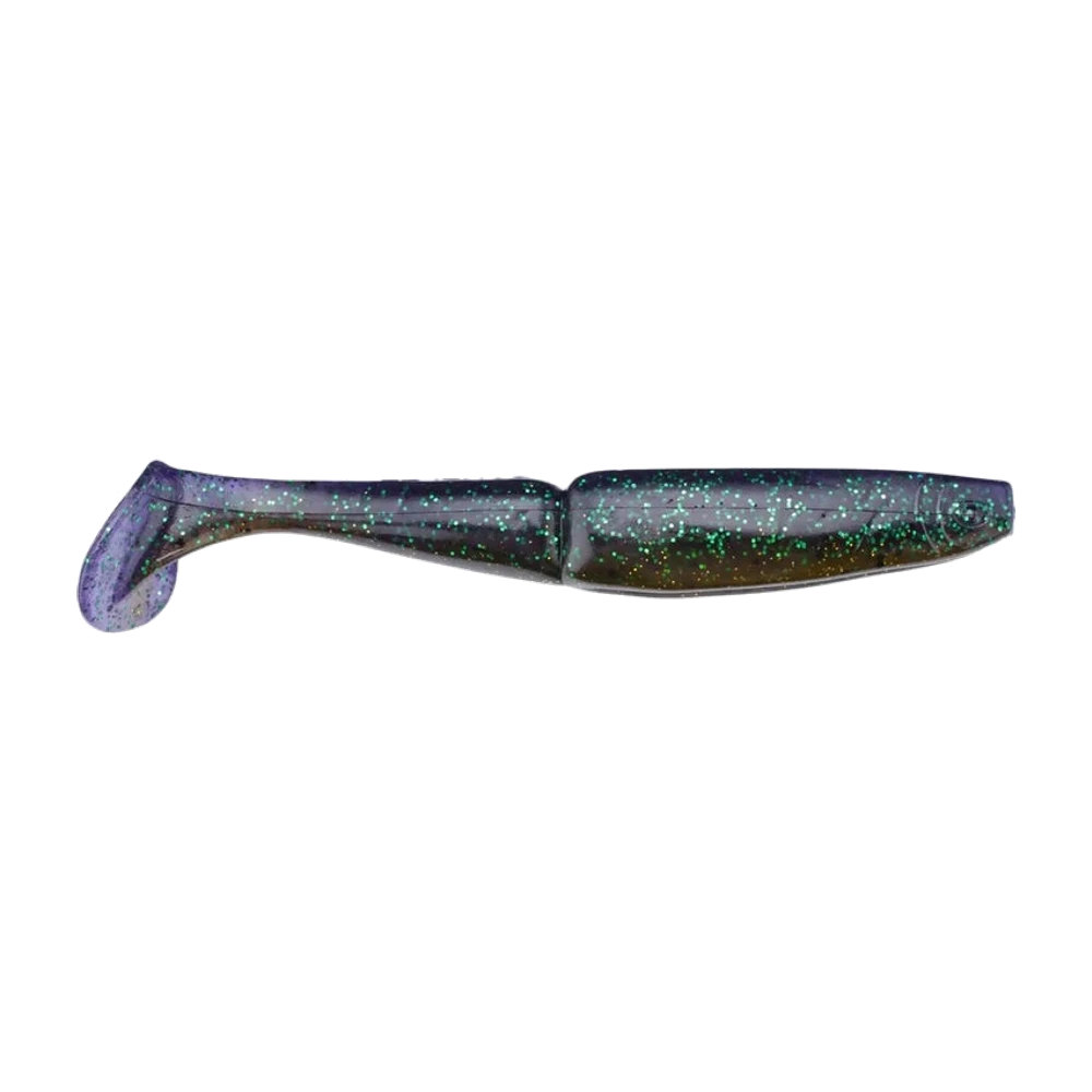Gambler EZ Swimmer 4,25 pouces nu, sans hameçon, corps violet translucide à paillettes vertes et dorées, segmentation visible derrière la tête, queue paddle arrondie
