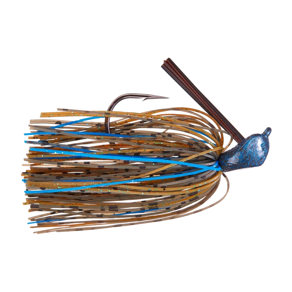 Googan Juicee Casting Jig, tête arkie bleu foncé à fortes paillettes bleues, garde-herbe en fibres brunes dressé, gros hameçon simple apparent, jupe nouée brun vert mouchetée de noir avec quelques brins bleu vif, monté sans trailer