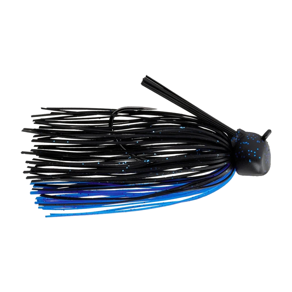 Keitech Crankin' Football Jig noir à paillettes bleues, tête anguleuse à facette avant plate et œillet en saillie, jupe silicone noire mêlée de brins bleus et violets, brosse de fibres noires dressée derrière la tête, hameçon simple visible sous la jupe