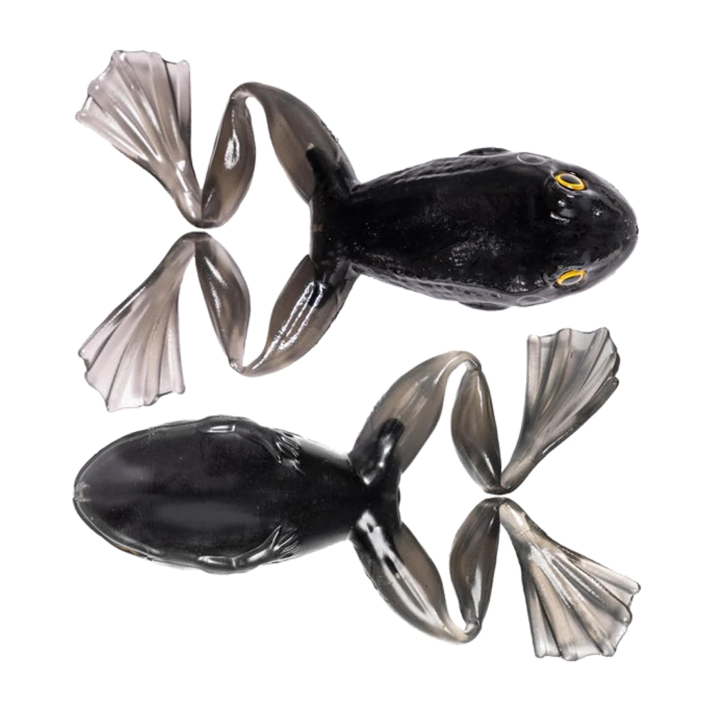 Deux LiveTarget ICT Freestyle Frog noires non armées, dos brillant texturé, pattes arrière palmées translucides gris fumé, yeux cerclés de jaune à pupille noire sur celle vue de dessus