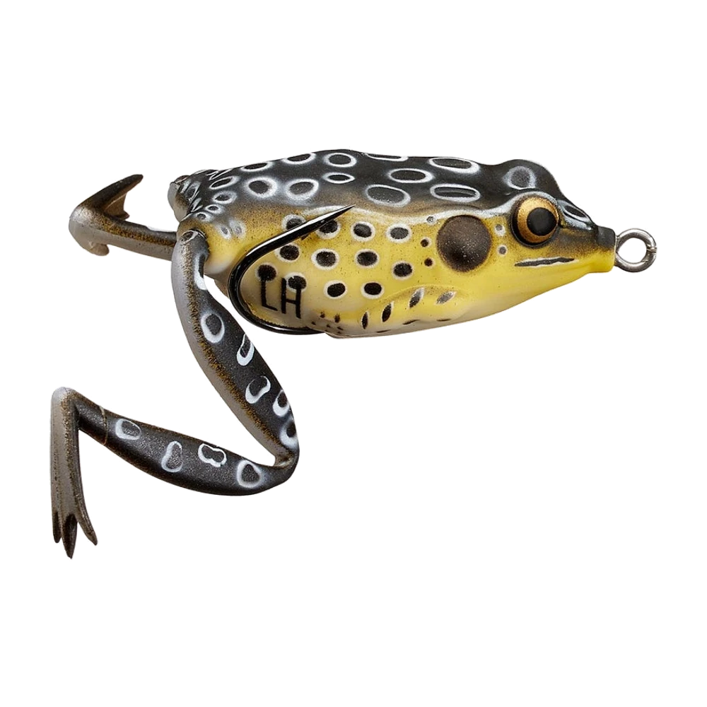 Lunkerhunt Lunker Frog de profil, dos gris-brun couvert de taches noires cerclées de blanc, flanc et ventre jaunes tachetés de noir, œil noir à iris doré, deux longues pattes arrière articulées à pieds palmés et deux pattes avant, hameçon double noir dont une pointe repose le long du flanc, anneau de tête argenté, marquage LH sur le flanc