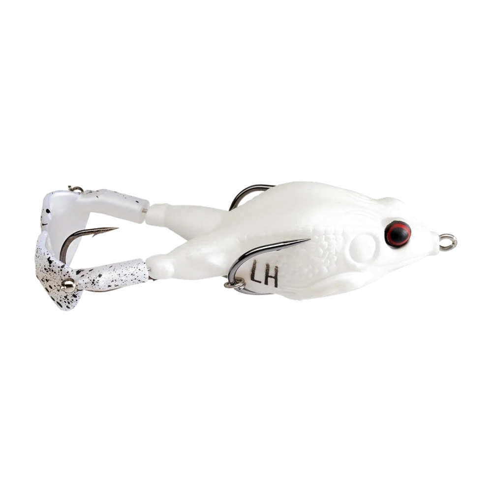 Lunkerhunt Prop Frog entièrement blanc mat, œil rouge à pupille noire, marquage LH sur le flanc, deux pattes arrière rigides blanches terminées par des palettes à hélice blanches mouchetées de noir montées sur roulement, armement argenté visible à plusieurs endroits avec une pointe sur le dos, une pointe le long du flanc reliée à un anneau brisé et un hameçon à deux pointes entre les hélices, anneau de tête argenté