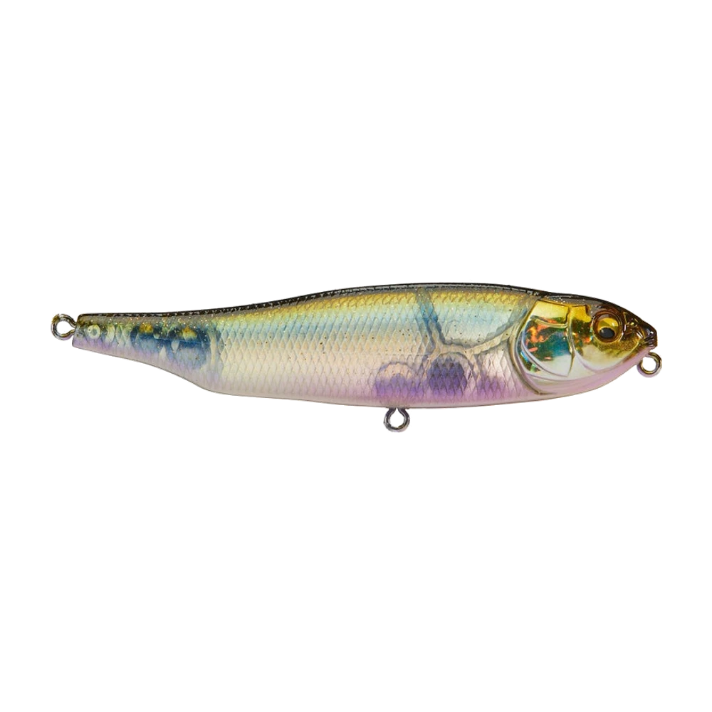 Megabass Giant Dog-X de profil, corps sans bavette, flancs nacrés écaillés aux reflets bleus et violets, opercule doré holographique, œil ambre, trois anneaux nus sans triples montés