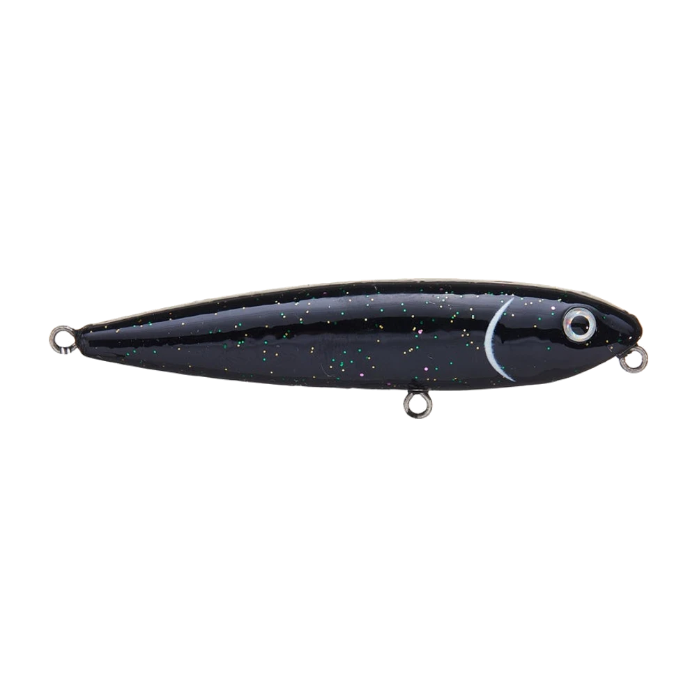 Strike King Bitsy Dawg, petit stickbait de surface noir à paillettes vertes et dorées, trait blanc en croissant derrière la tête, gros œil 3D argenté, photographié nu avec trois anneaux brisés et aucun triple monté